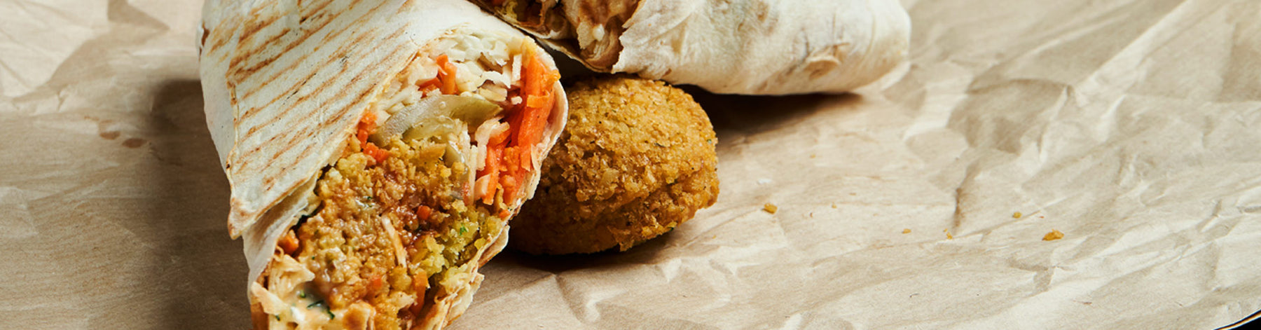 Shawarma chicken with Greek salad, flatbread, and homemade falafels