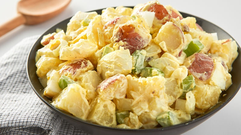 Christmas Classic potato salad with crispy bacon, spring onion, boiled eggs and mayo - serves 4 people