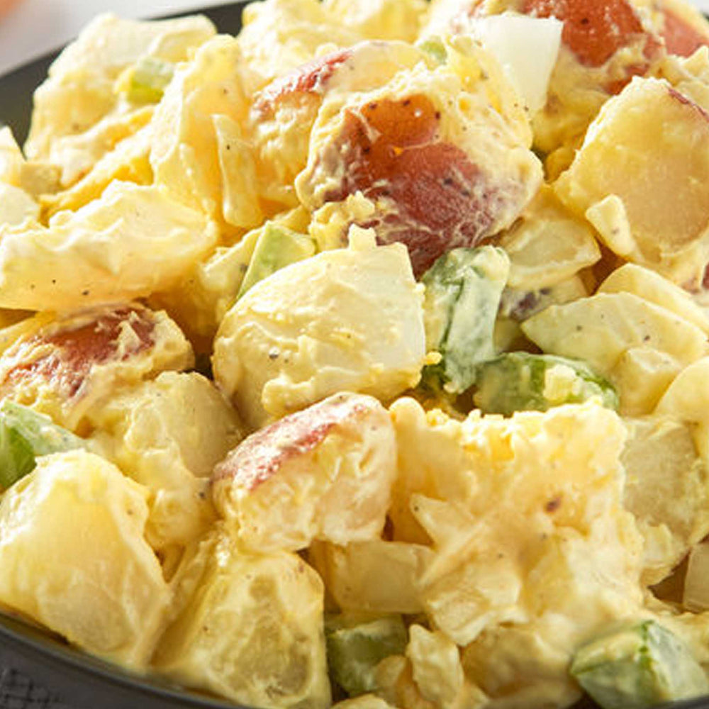Classic potato salad with crispy bacon, spring onion, boiled eggs and mayo - serves 4 people